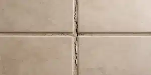 what causes grout to crack